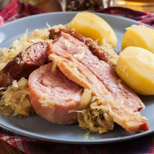 Choucroute garnie. Alsatian sauerkraut with sausages, knuckle and bacon
